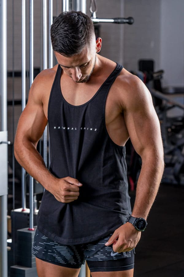 Male wearing black singlet