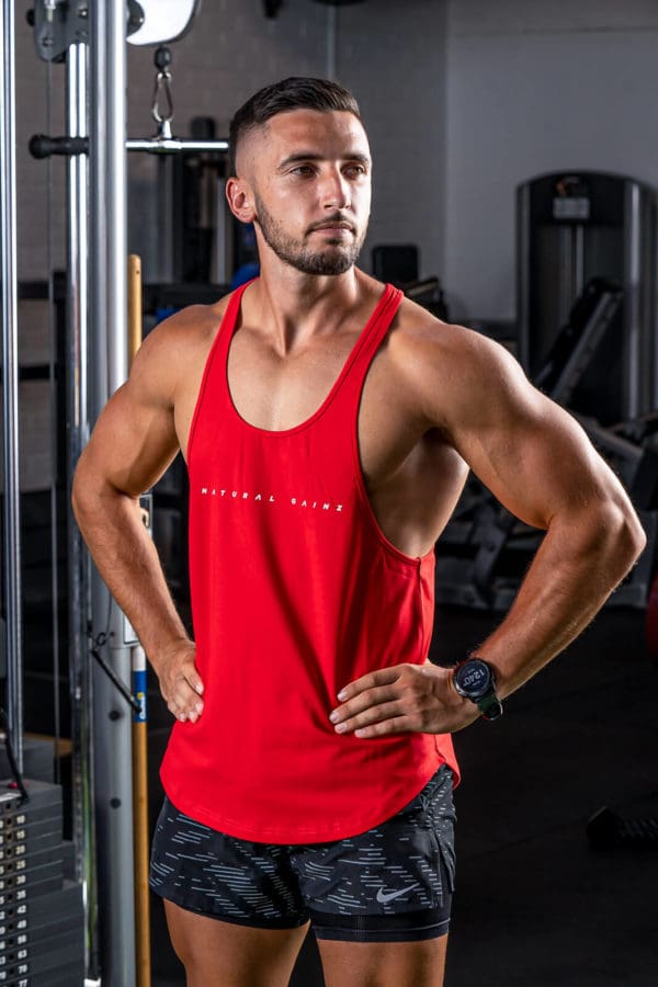 Man wearing YNF red singlet