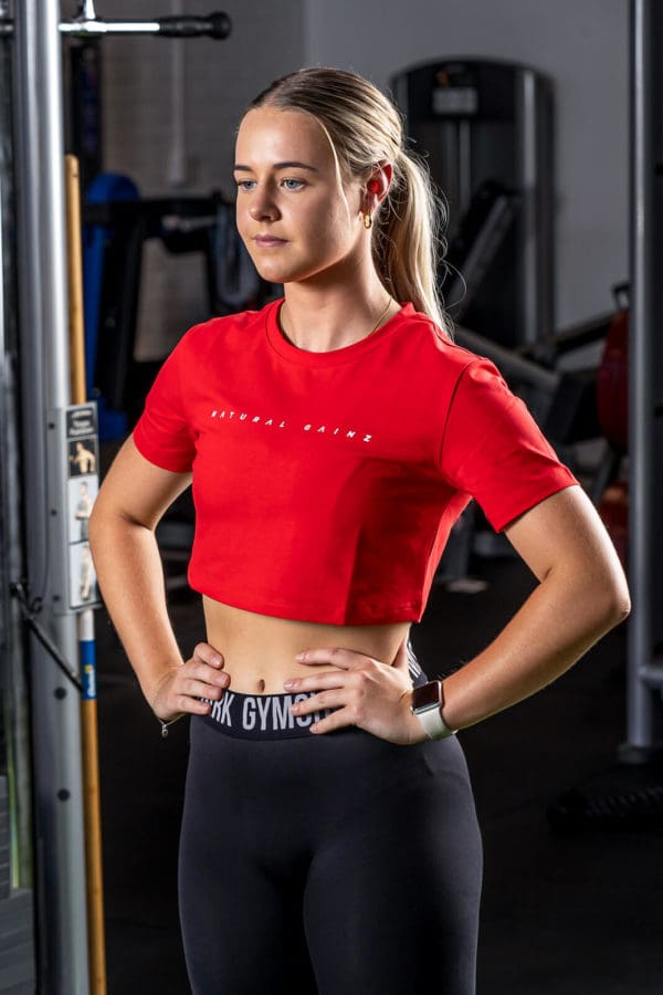 Women wearing red YNF crop top
