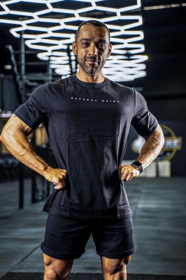 Male wearing black YNF shirt