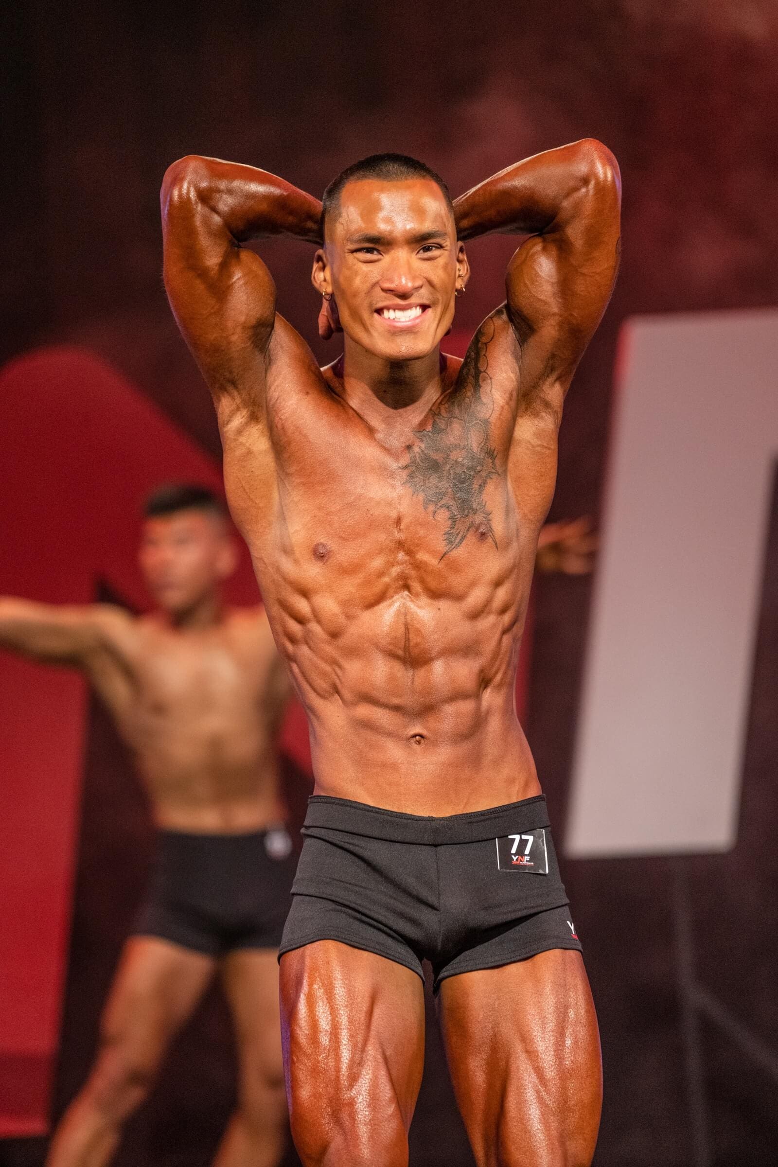 Bodybuilder flexing on stage