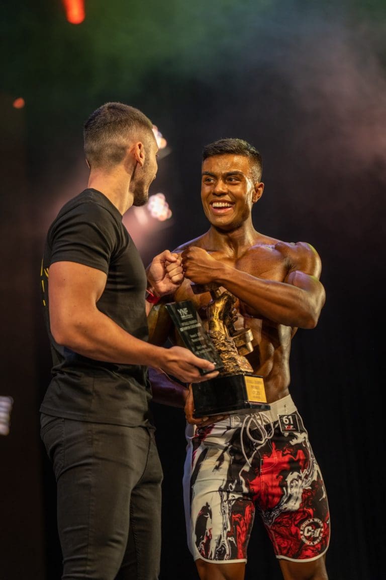 Bodybuilders on stage at a YNF Federation competition