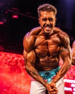 Bodybuilder flexing his muscles